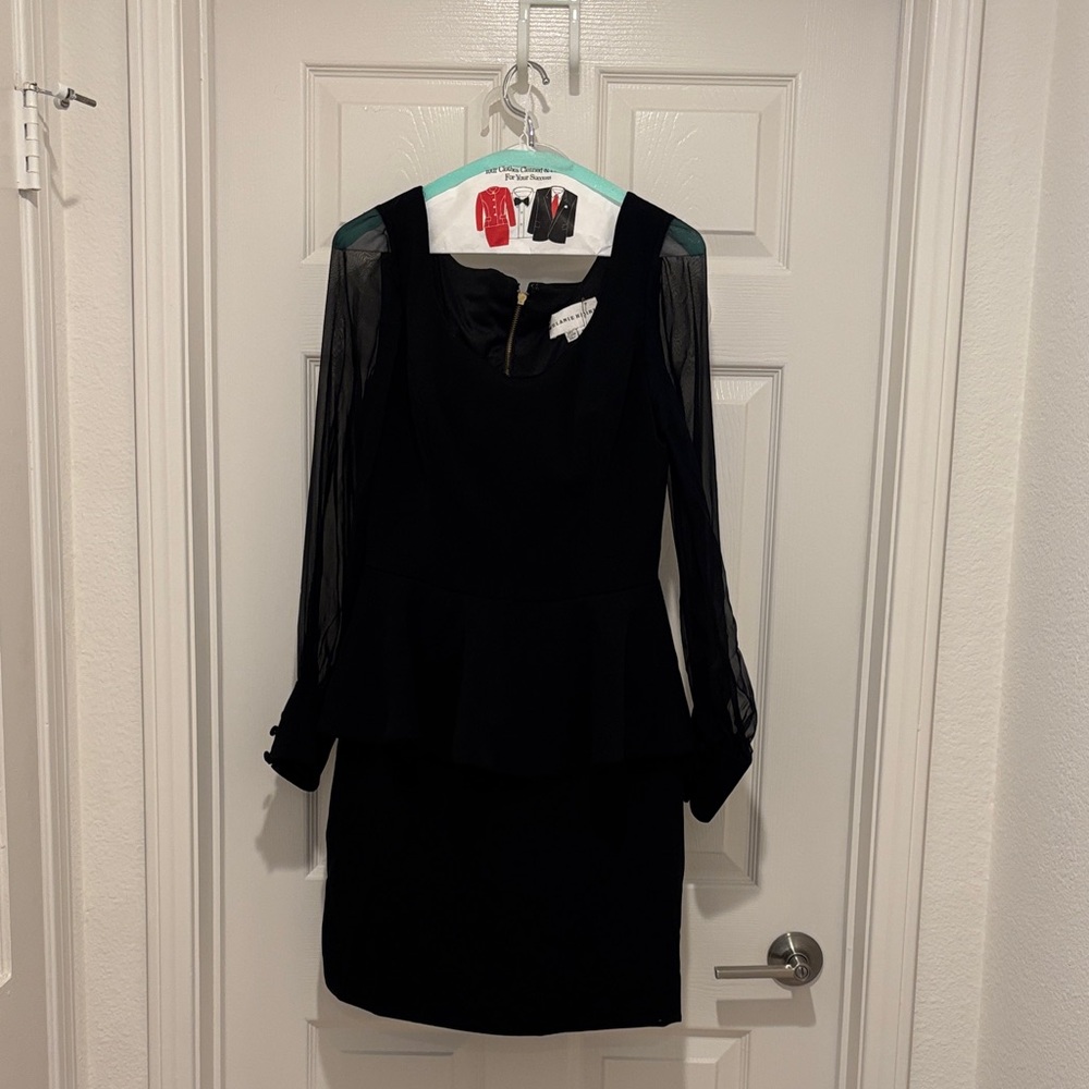 Black Sheer-Sleeve Peplum Dress.  Seen on The Real Housewives of New York.